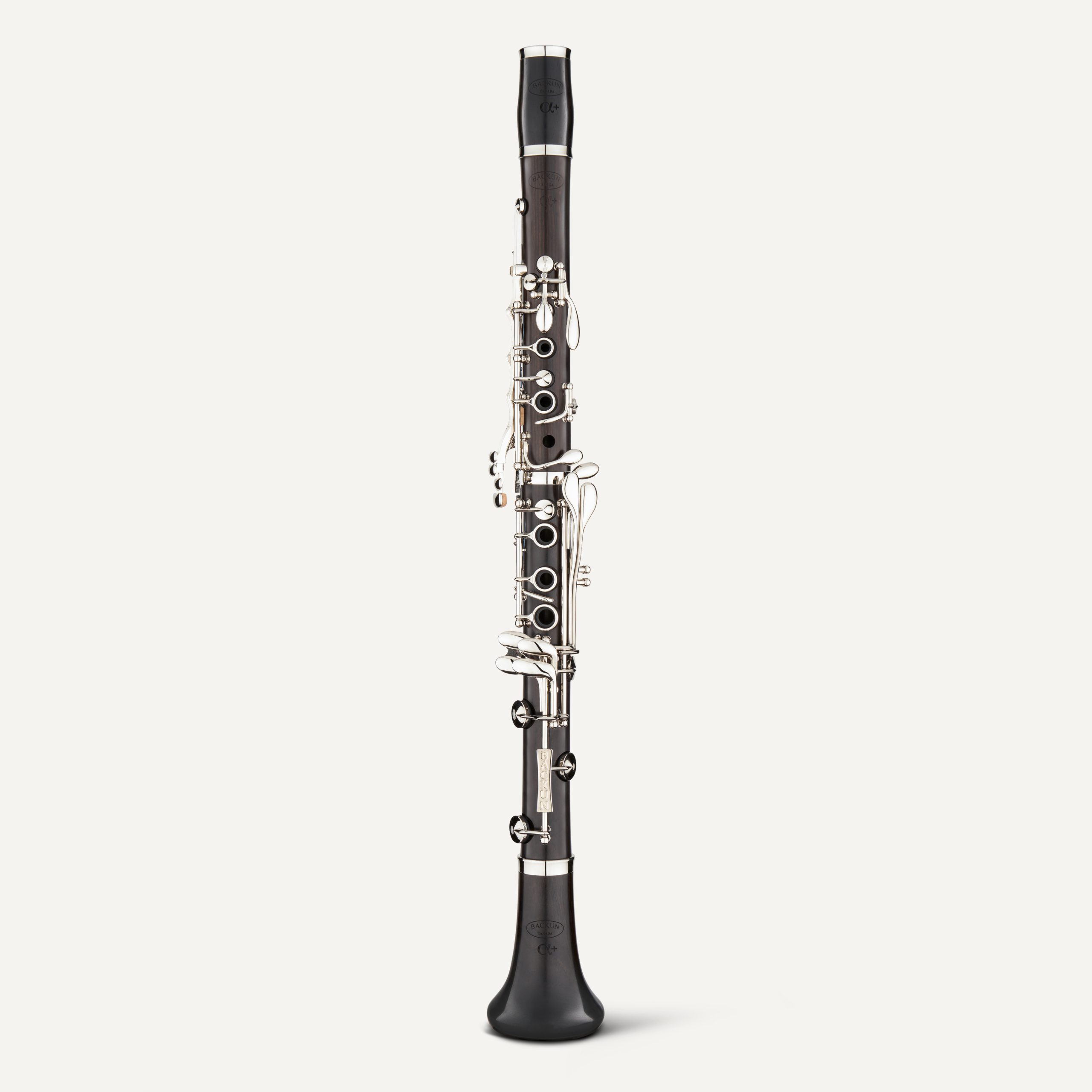 The Backun Alpha Plus Bb Clarinet with silver keys stands upright against a plain white background.