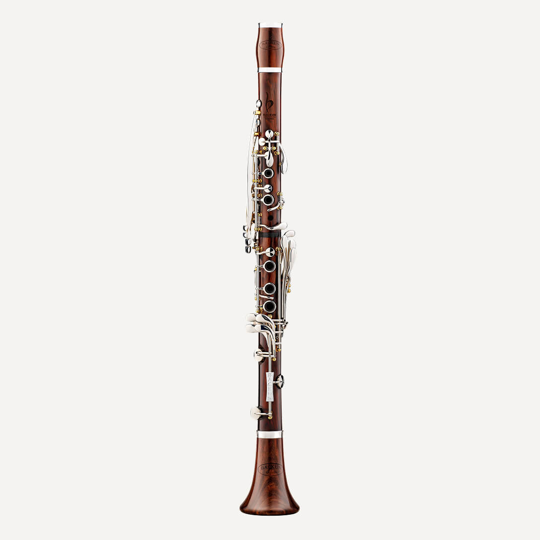 The Backun Essence A Clarinet, crafted from wood with silver keys, stands upright against a plain white background.