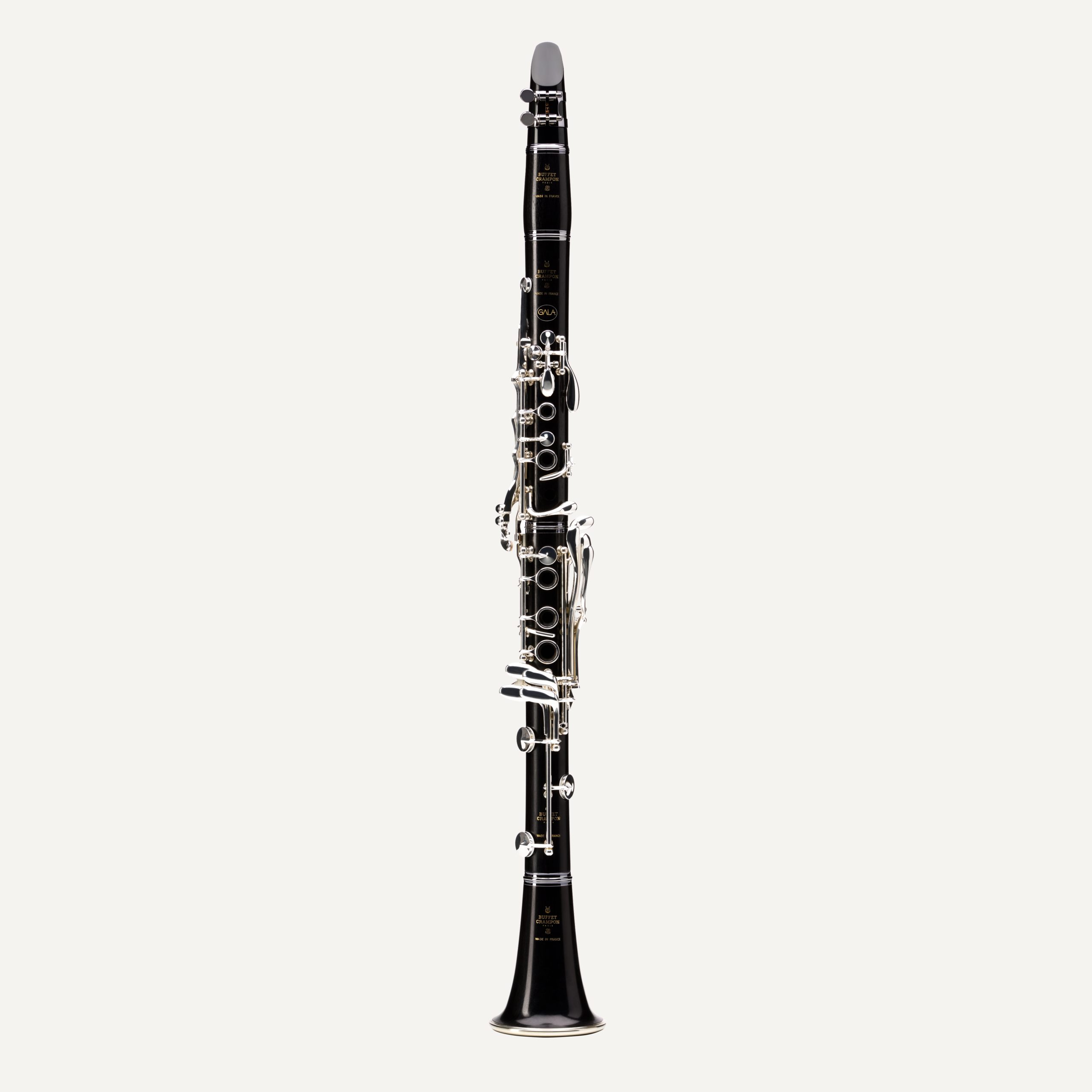 The Buffet Gala Bb Clarinet, featuring a black body and silver keys, stands upright against a plain white background.