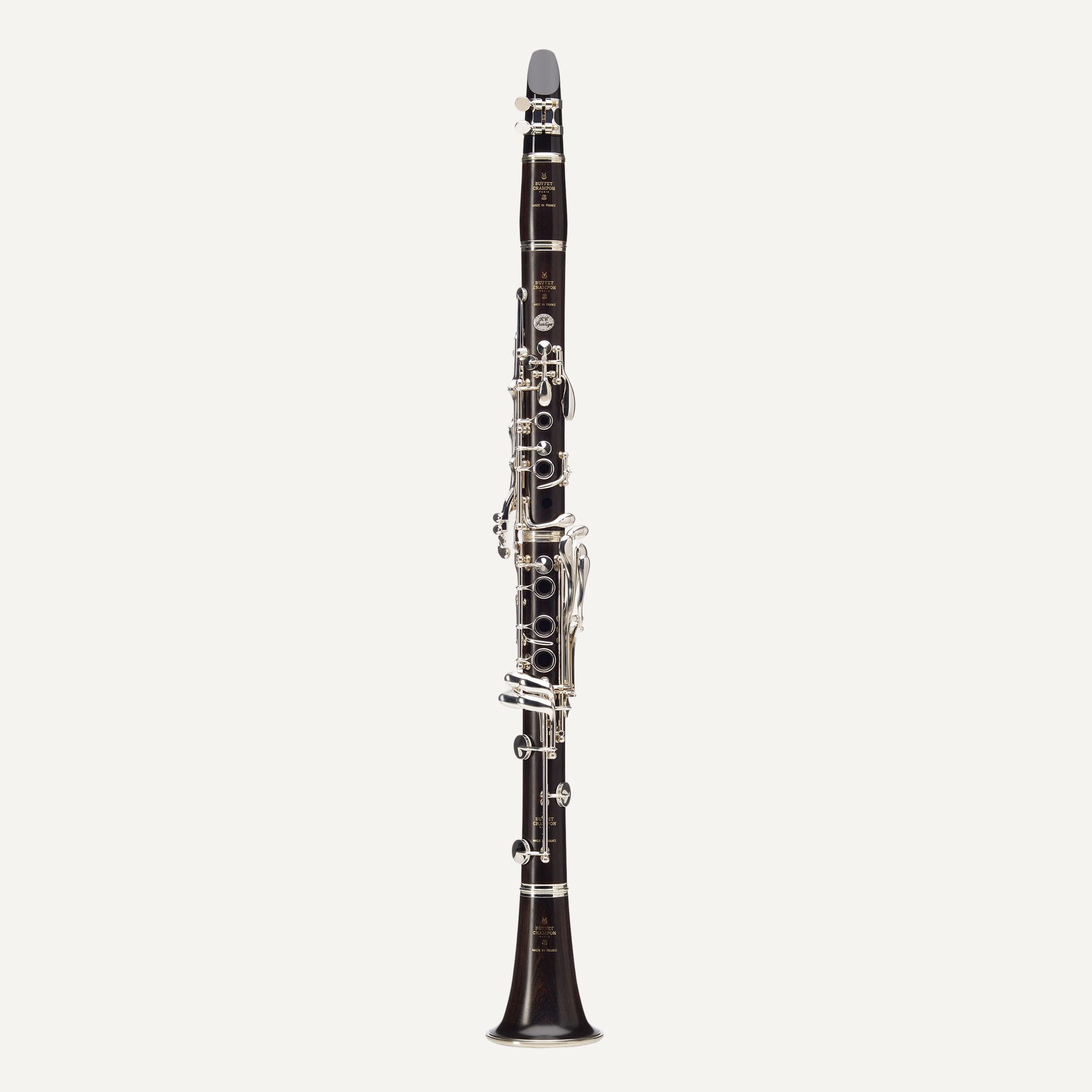 The Buffet RC Prestige A Clarinet, featuring a black body and silver keys, is displayed upright against a plain white background.