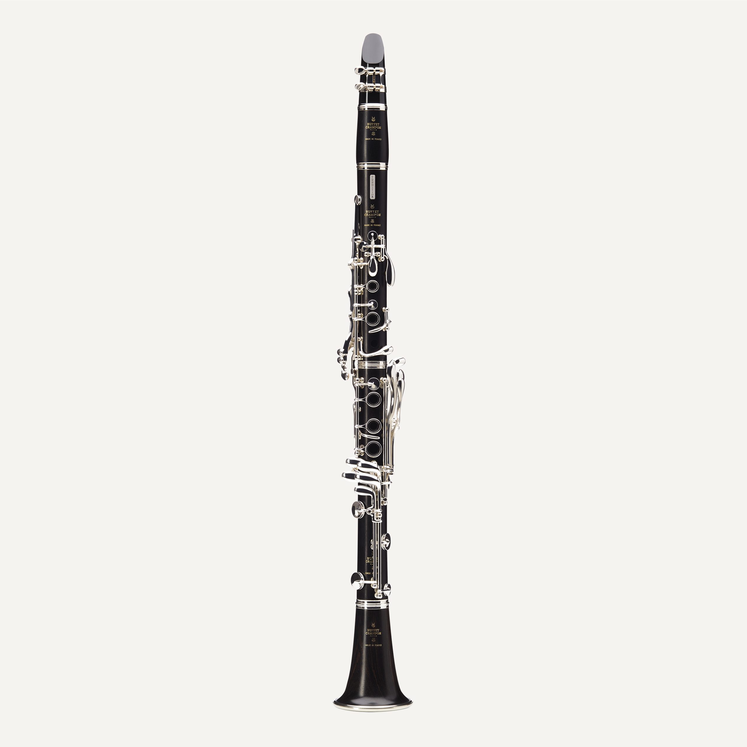 The Buffet Tradition A Clarinet, featuring a black body and silver keys, is displayed upright against a plain white background.