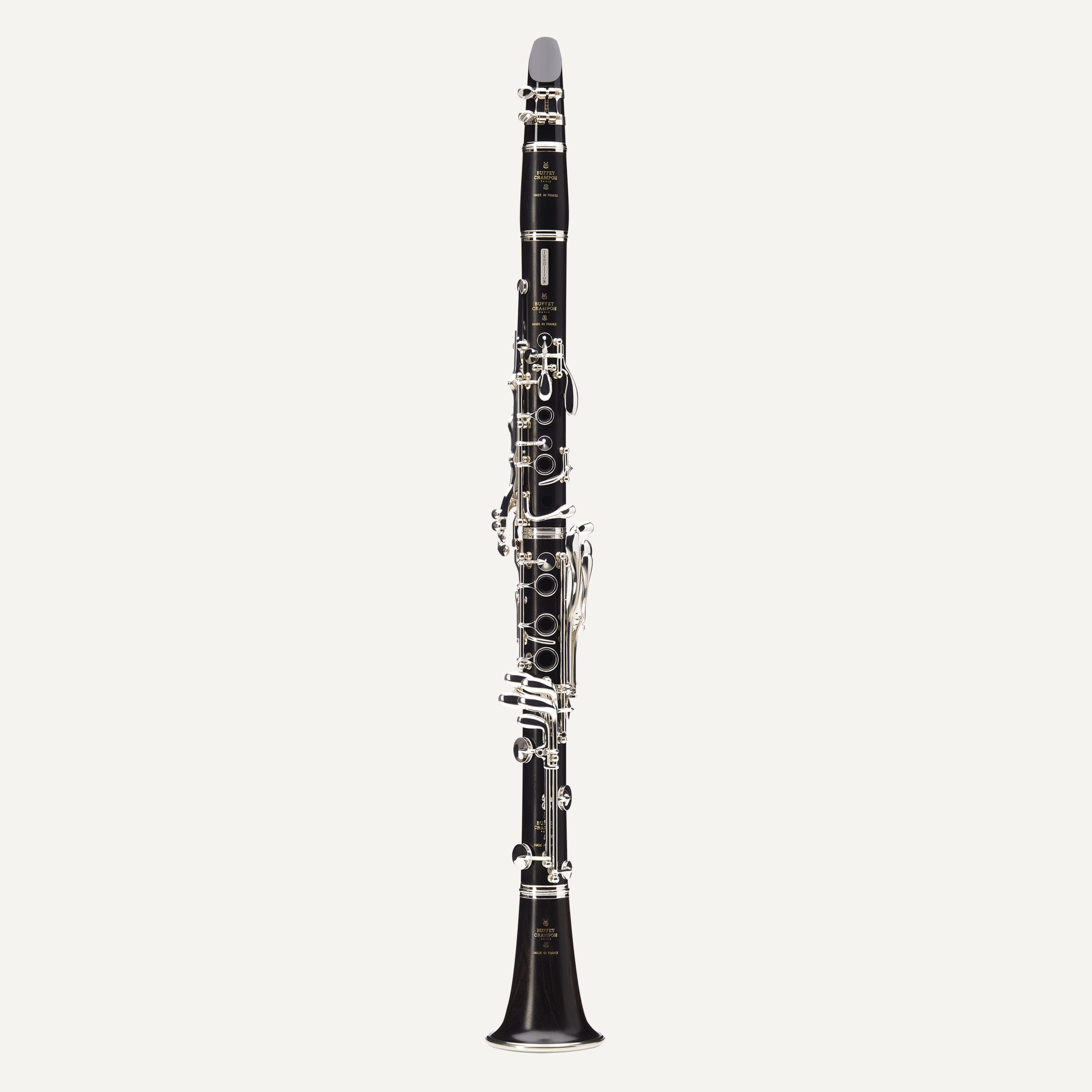 The Buffet Tradition Bb Clarinet, featuring a black body and silver keys, is displayed upright against a plain white background.